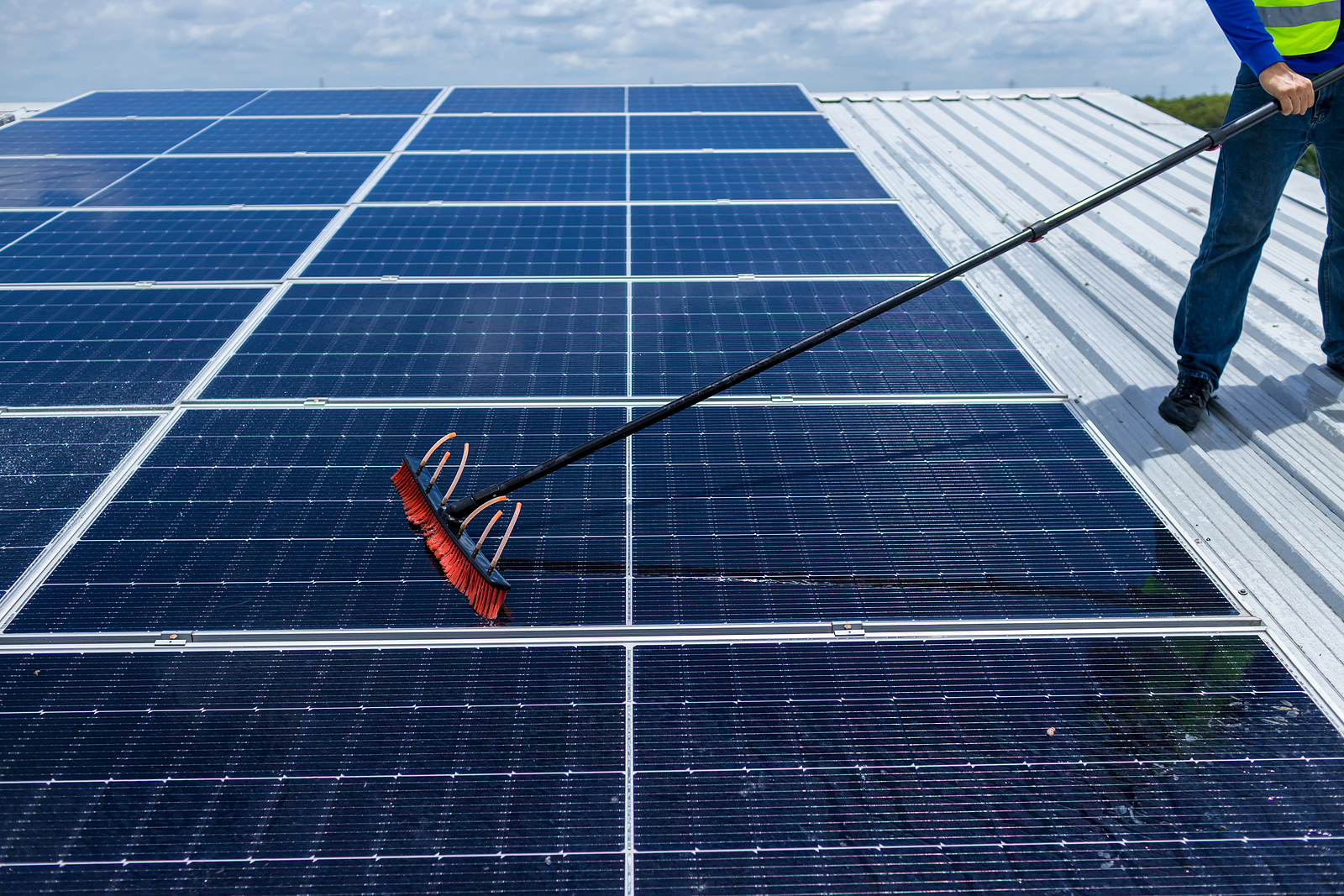 bigstock-Worker-Cleaning-Solar-Panels-W-456990545.jpg?Revision=tCK&Timestamp=0TT167